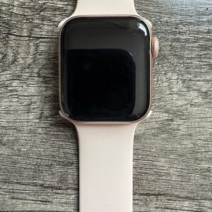 Apple Smartwatch with Black Display and Cream Band